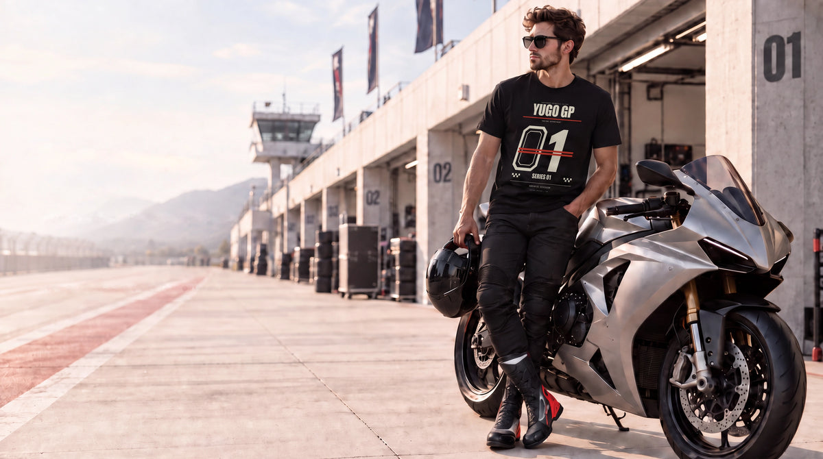 Yugo GP rider-inspired apparel beside a motorcycle in the paddock